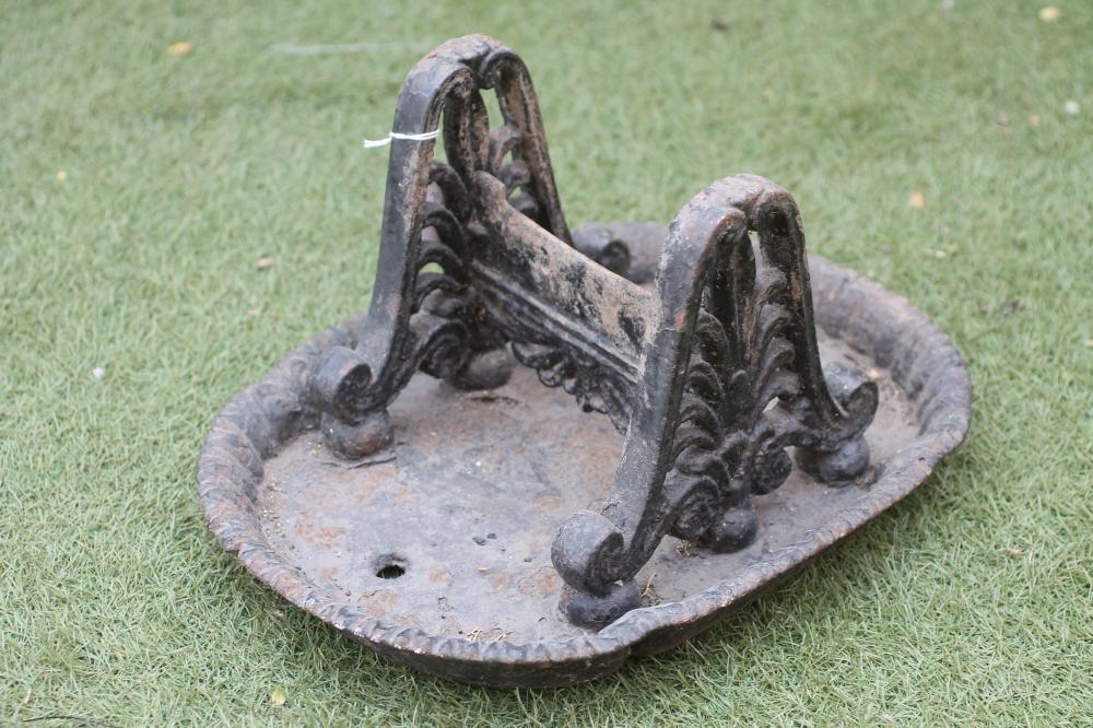 A VICTORIAN CAST IRON FOOT SCRAPER of rounded oblong form with foliate moulded rim Image