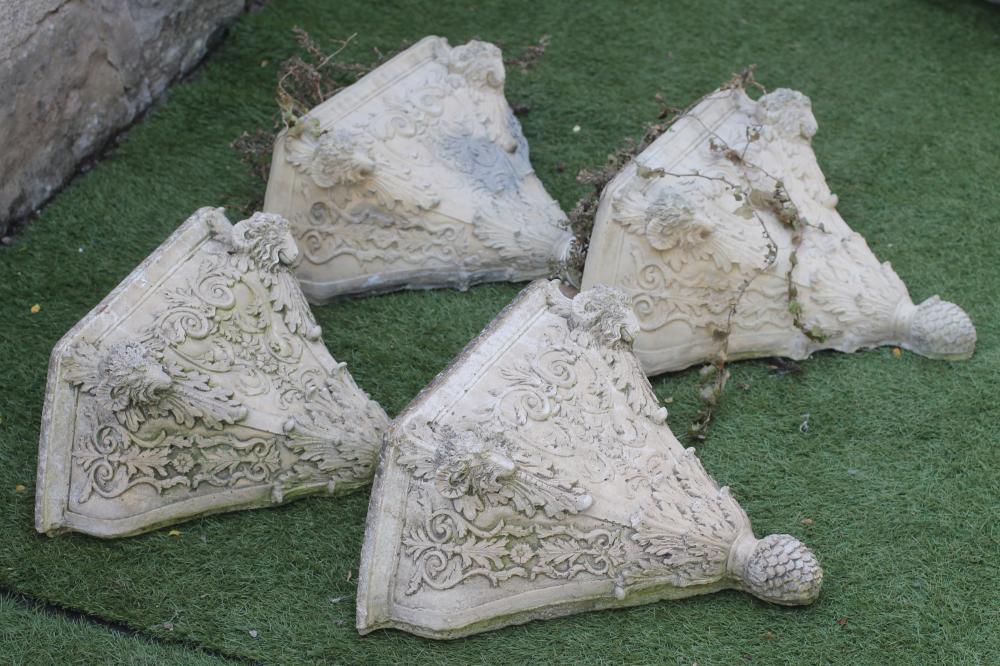 A SET OF FOUR COMPOSITION STONE WALL POCKETS of square tapering form moulded with Renaissance style Image