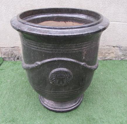 A LARGE GLAZED STONEWARE URN Image