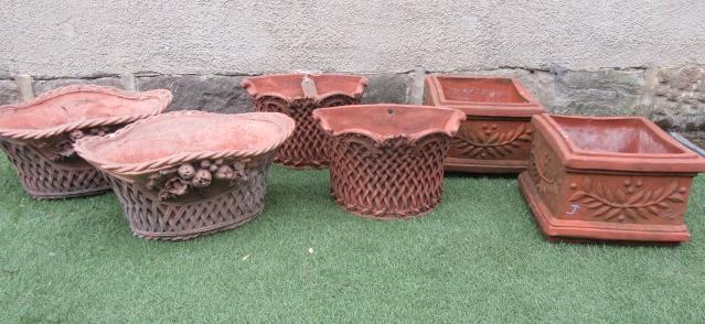 A PAIR OF FRENCH STYLE TERRACOTTA OVAL PLANTERS of oval form with waved cable twist rim Image