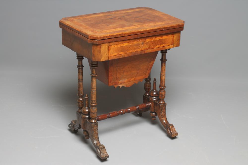 A VICTORIAN WALNUT GAMES/WORK TABLE of canted oblong form with yew banding and stringing Image
