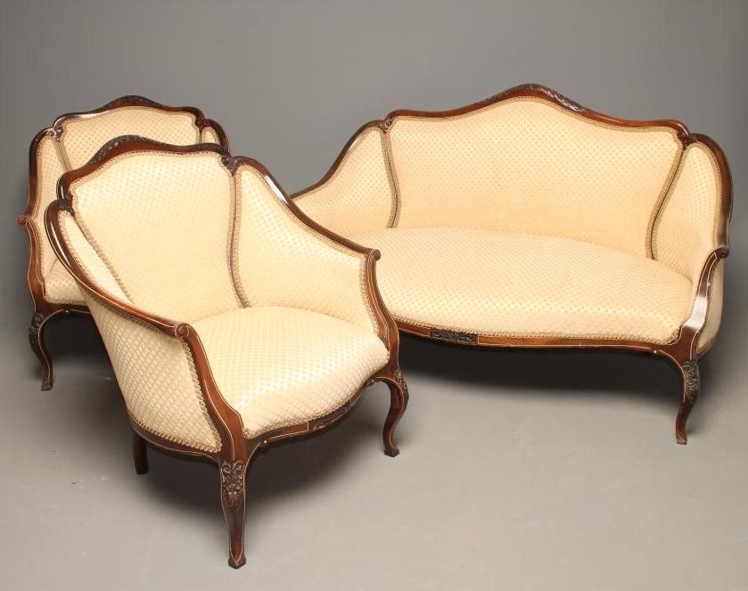 A LATE VICTORIAN MAHOGANY SHOW-WOOD FRAME SALON SUITE with bone line stringing and upholstered in a Image
