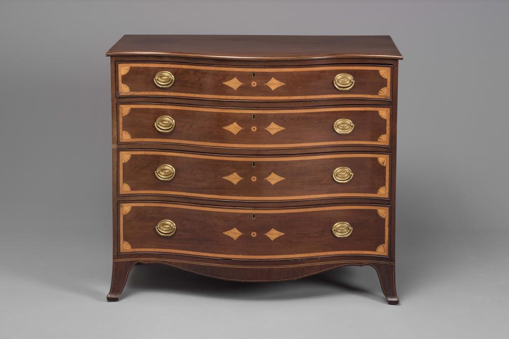 A VICTORIAN MAHOGANY SERPENTINE CHEST Image