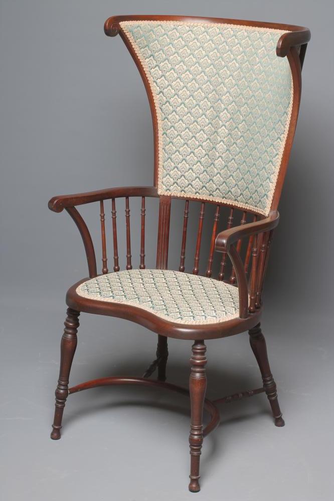 A MAHOGANY FRAMED WINDSOR STYLE ARMCHAIR upholstered in a green and ivory weave Image
