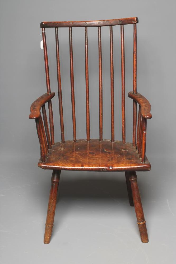 A PRIMITIVE ASH AND ELM STICK BACK WINDSOR ARMCHAIR Image