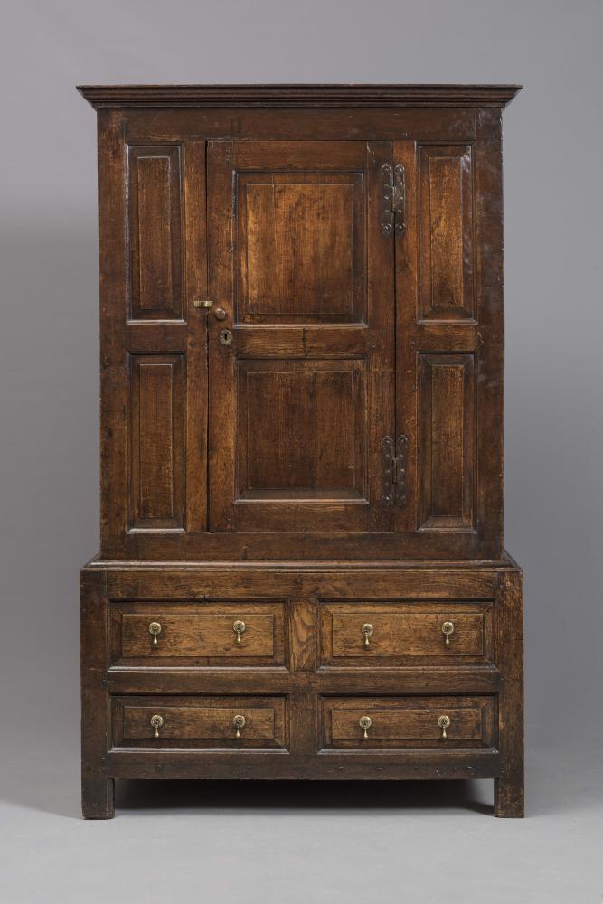 AN OAK PANELLED CUPBOARD Image