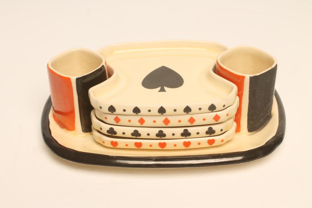 A ROYAL DOULTON POTTERY ART DECO BRIDGE SET of rounded oblong form printed in underglaze black and Image