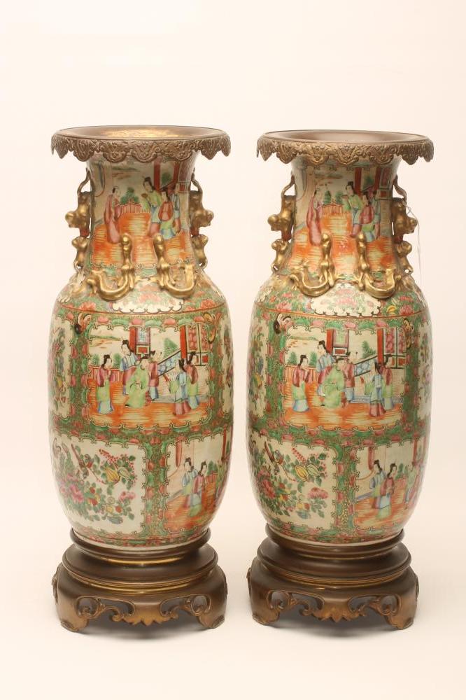 A PAIR OF CANTONESE PORCELAIN VASES of rounded cylindrical form with chi-long handles and Image