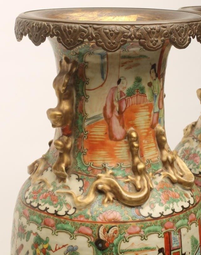 A PAIR OF CANTONESE PORCELAIN VASES of rounded cylindrical form with chi-long handles and Image
