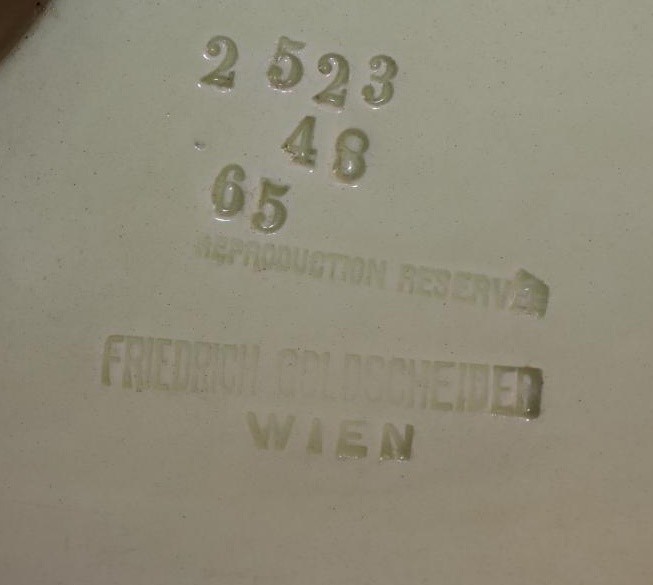 A SECESSIONIST GOLDSCHEIDER EARTHENWARE FIGURAL MANTEL CLOCK CASE Image