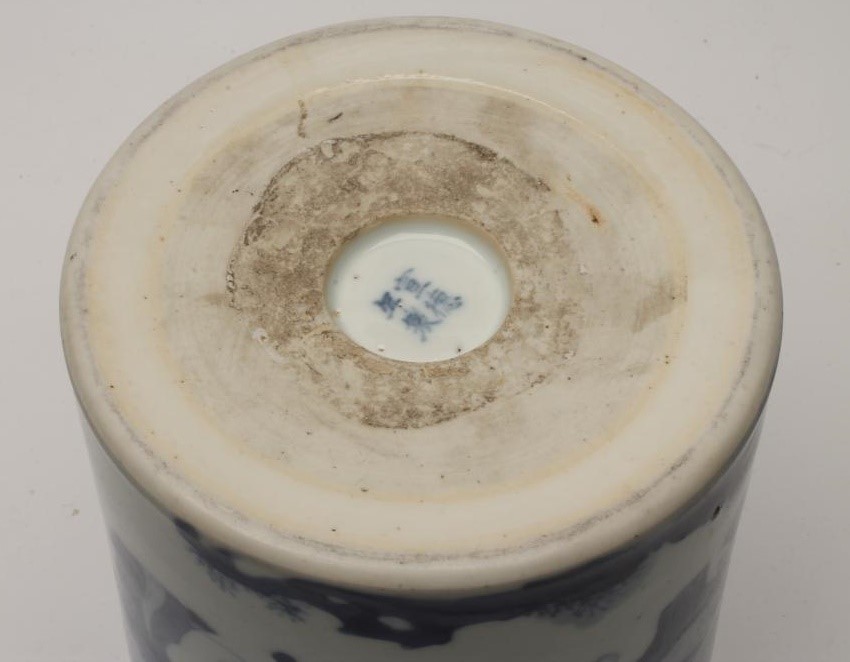 A CHINESE PORCELAIN BRUSH POT of plain cylindrical form painted in underglaze blue with a continuous Image