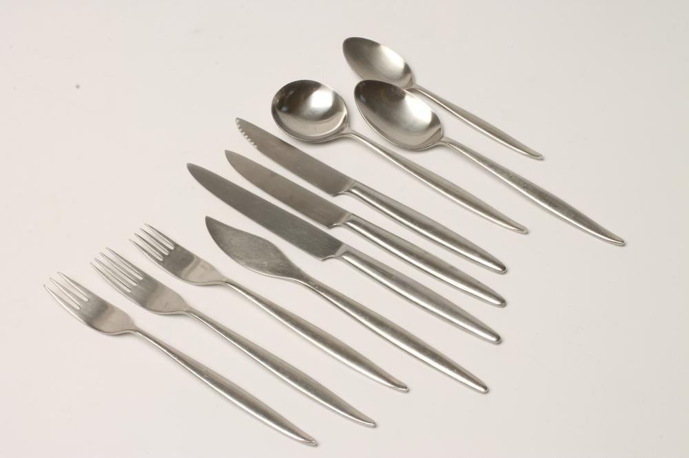 A WOSTENHOLM STAINLESS STEEL PART TABLE SERVICE in the Monte Carlo pattern designed by Geoffrey Image