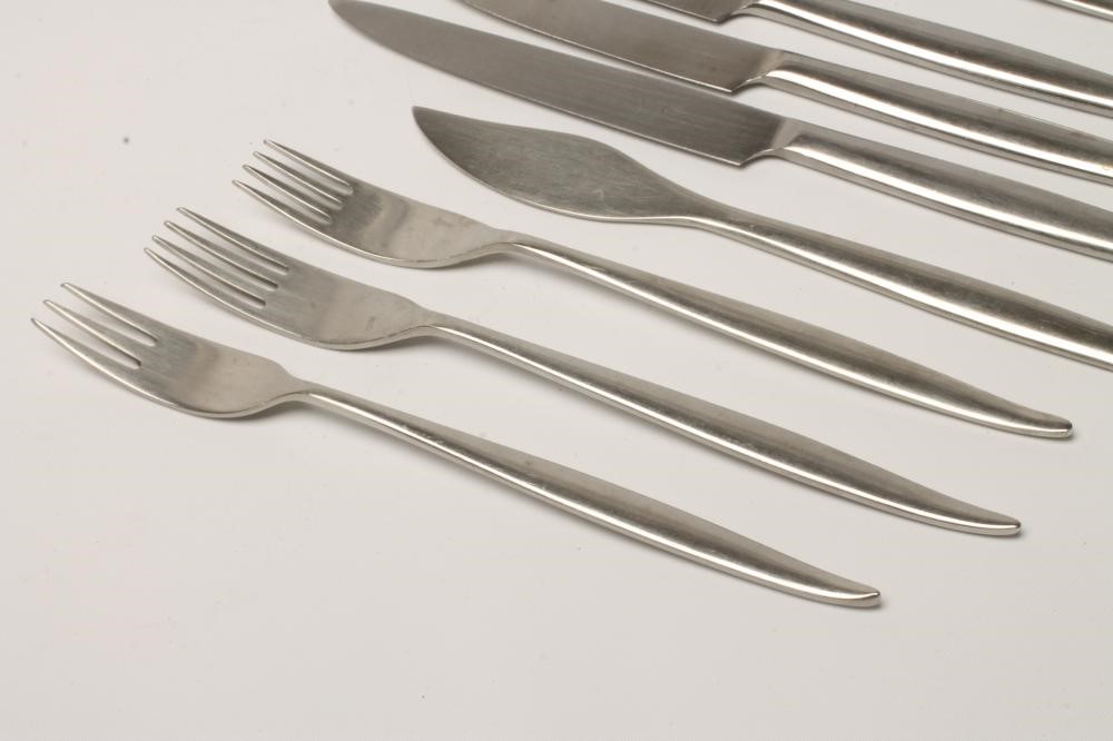 A WOSTENHOLM STAINLESS STEEL PART TABLE SERVICE in the Monte Carlo pattern designed by Geoffrey Image