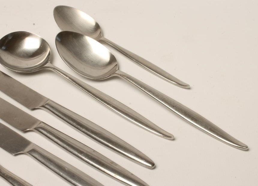 A WOSTENHOLM STAINLESS STEEL PART TABLE SERVICE in the Monte Carlo pattern designed by Geoffrey Image