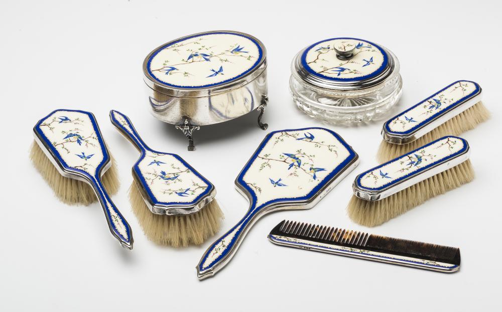 AN ART DECO SILVER EIGHT PIECE DRESSING TABLE SET Image