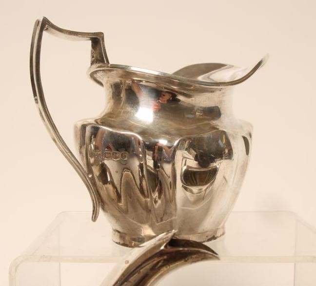 *A SILVER THREE PIECE TEA SERVICE Image