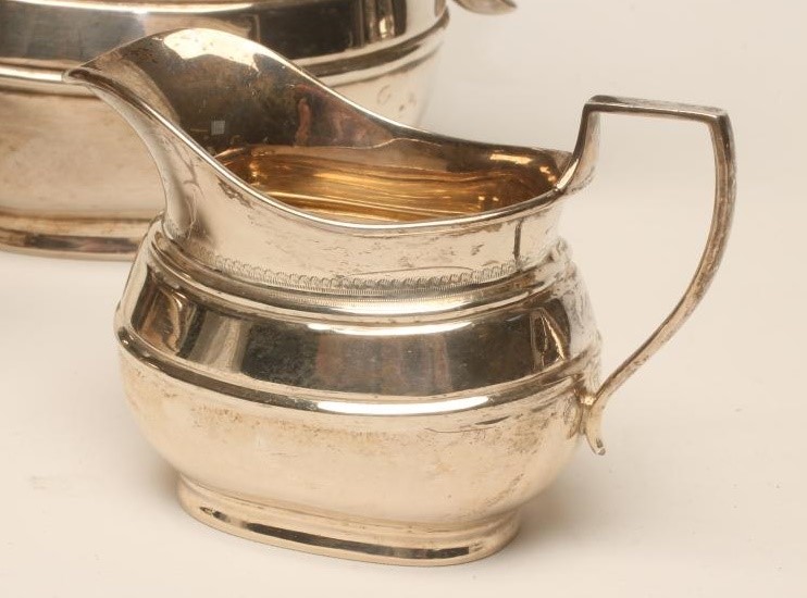 *A SILVER FOUR PIECE TEA AND COFFEE SERVICE Image