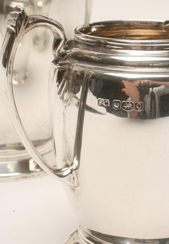 *A THREE PIECE SILVER TEA SERVICE Image