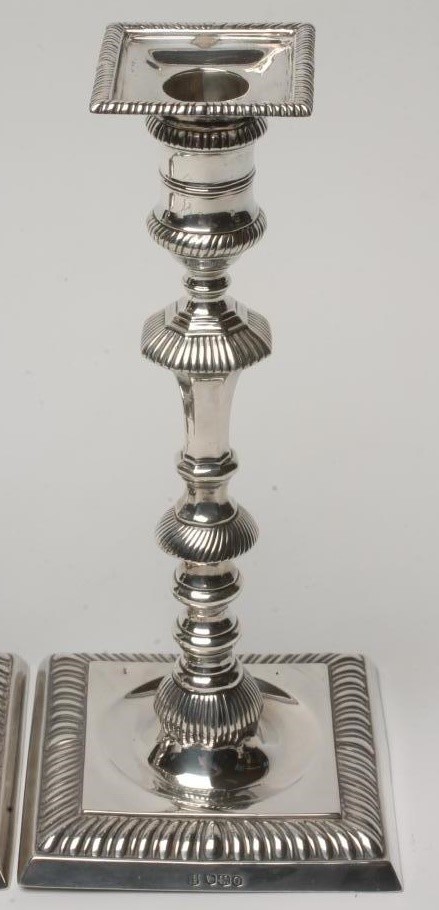 A PAIR OF SILVER CANDLESTICKS Image