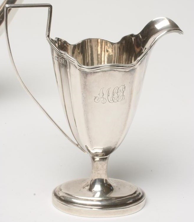 AN EDWARDIAN SILVER THREE PIECE TEA SERVICE Image