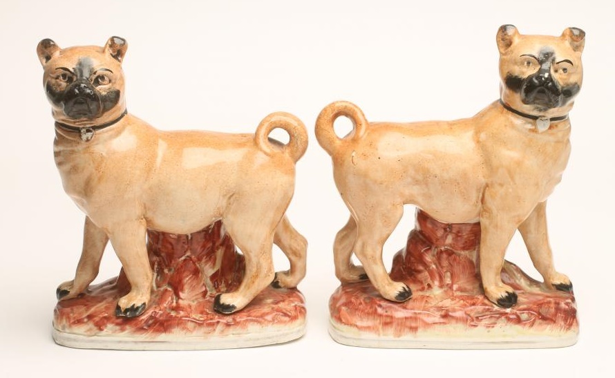 A PAIR OF LATE VICTORIAN STAFFORDSHIRE POTTERY PUGS Image