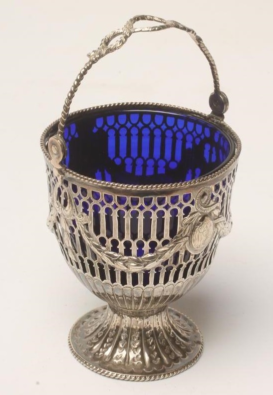 A GEORGE III SILVER SUGAR BASKET Image