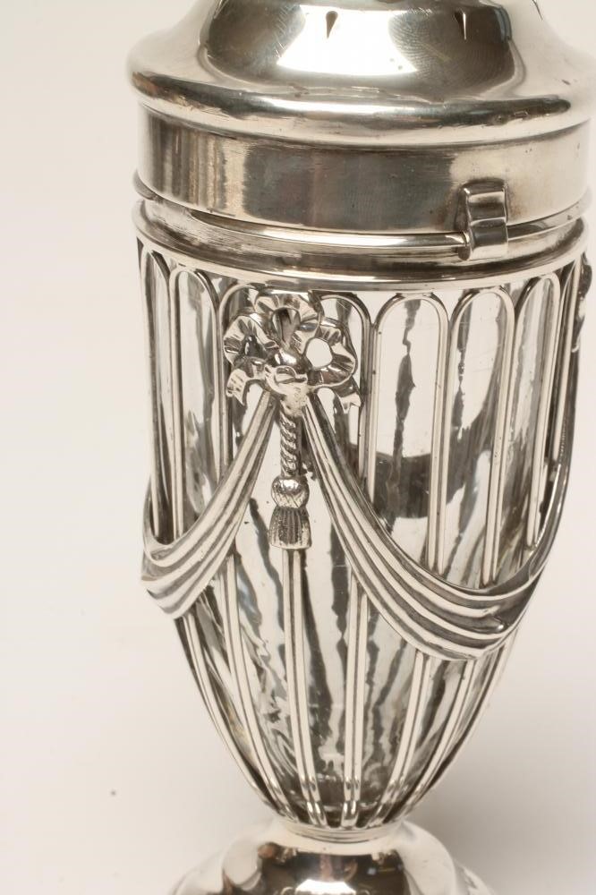 AN EDWARDIAN SILVER WIREWORK SUGAR CASTOR Image