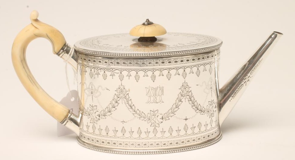 A VICTORIAN SILVER TEAPOT Image