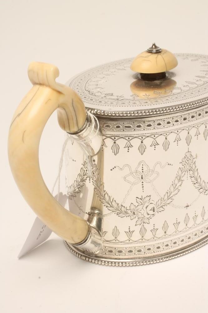 A VICTORIAN SILVER TEAPOT Image