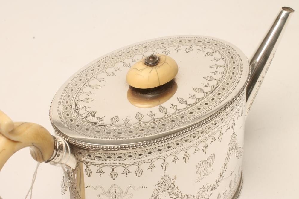 A VICTORIAN SILVER TEAPOT Image