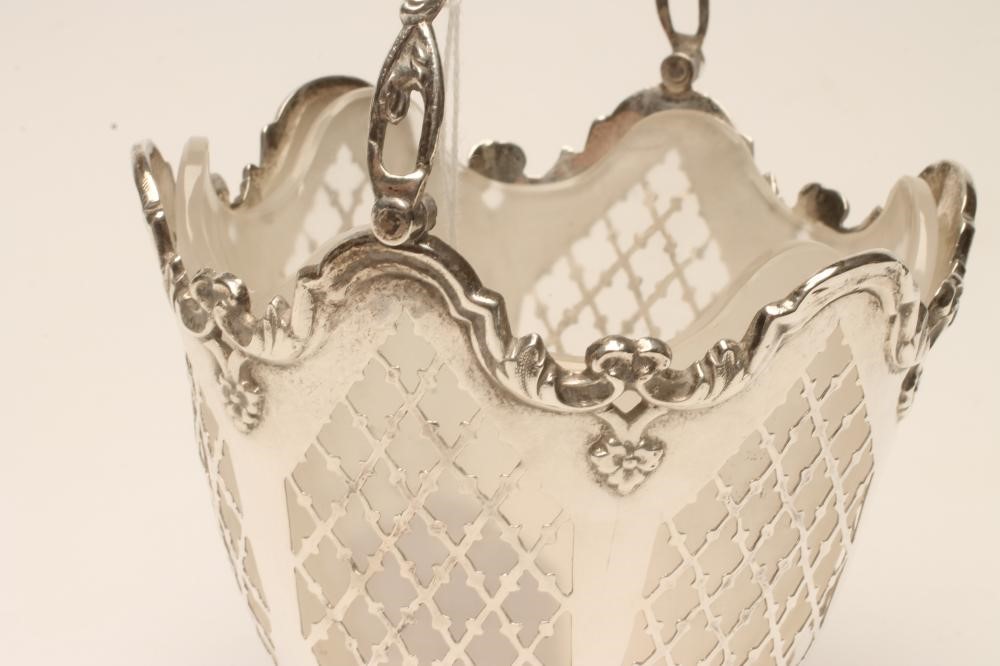 A VICTORIAN SILVER SUGAR BASKET Image