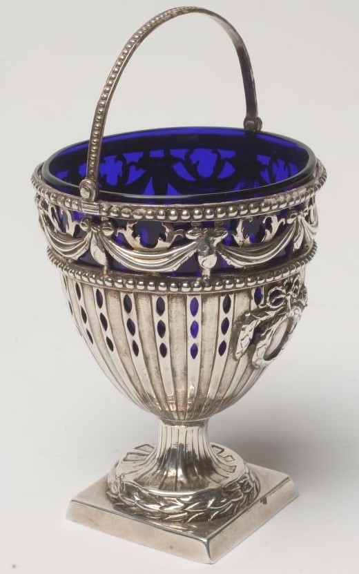 A GEORGE III SILVER SUGAR BASKET Image