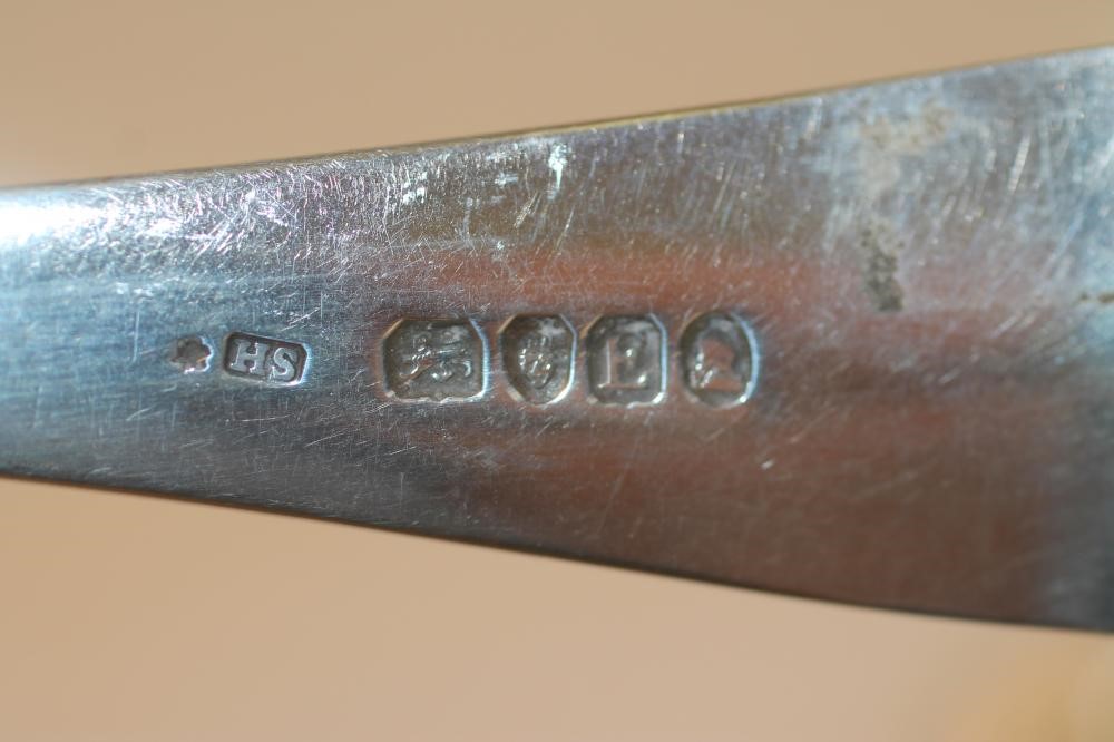 A LATE GEORGE III SILVER BASTING SPOON Image