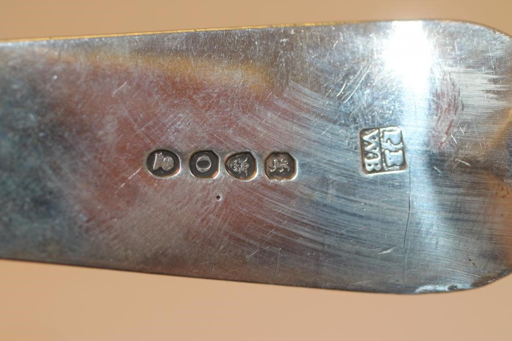 A LATE GEORGE III SILVER BASTING SPOON Image