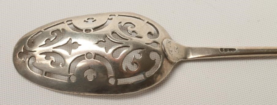 A GEORGE II SILVER MOTE SPOON Image