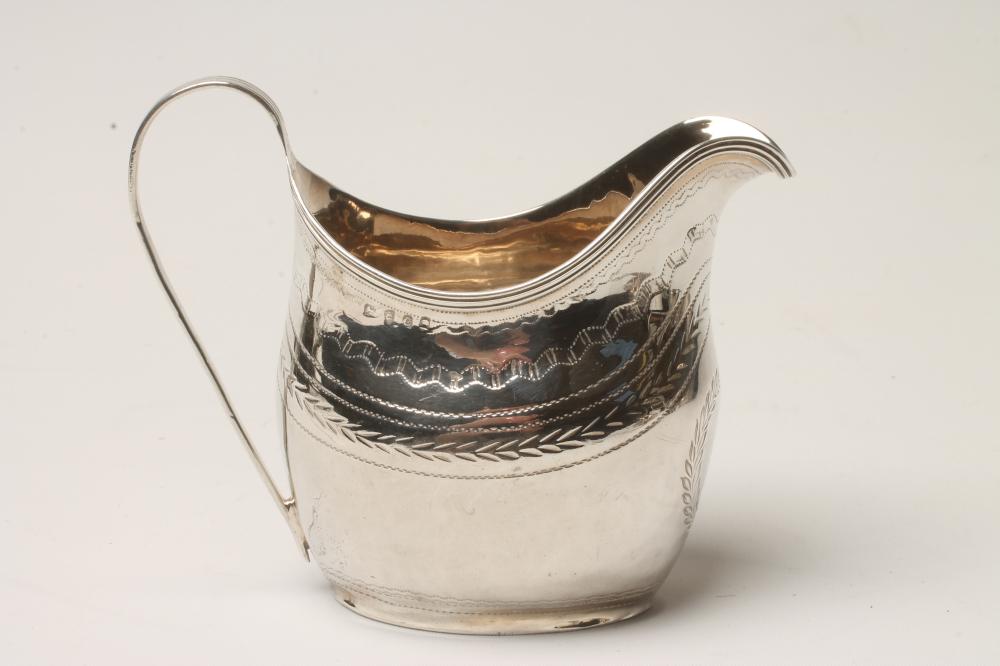 A GEORGE III SILVER MILK JUG Image