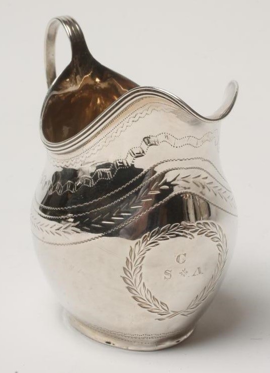 A GEORGE III SILVER MILK JUG Image