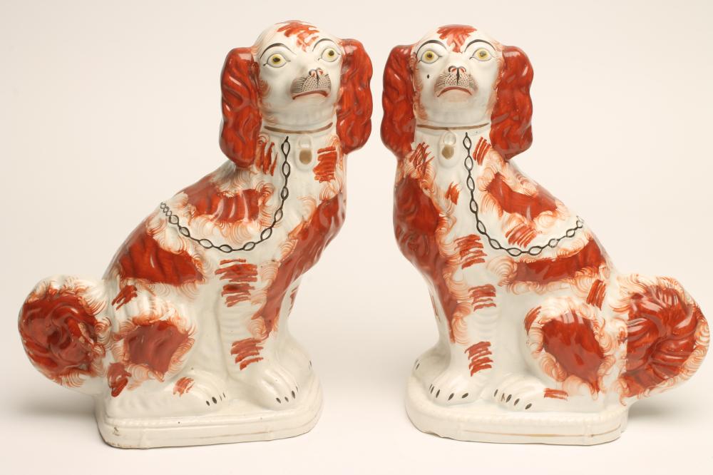 A PAIR OF VICTORIAN STAFFORDSHIRE POTTERY SPANIELS Image