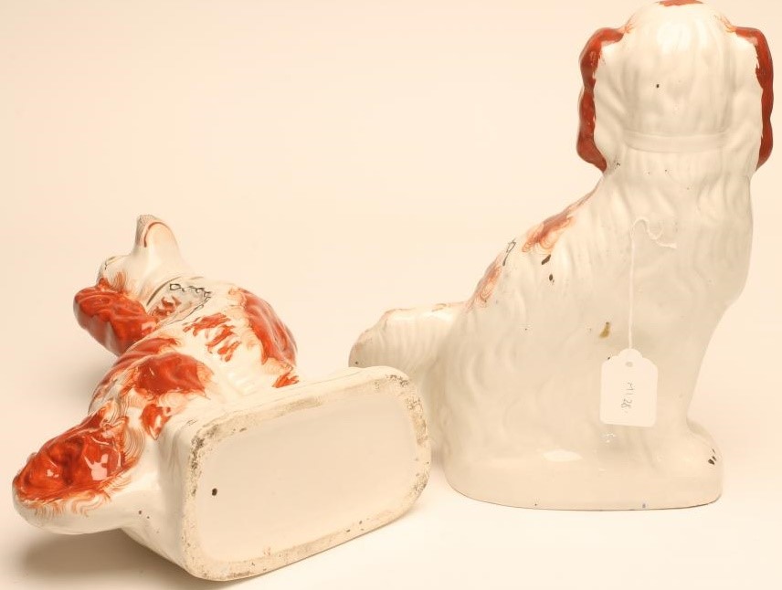 A PAIR OF VICTORIAN STAFFORDSHIRE POTTERY SPANIELS Image