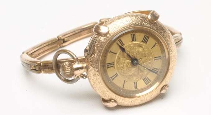 A LADY'S 14K GOLD TOP WIND FOB WATCH Image
