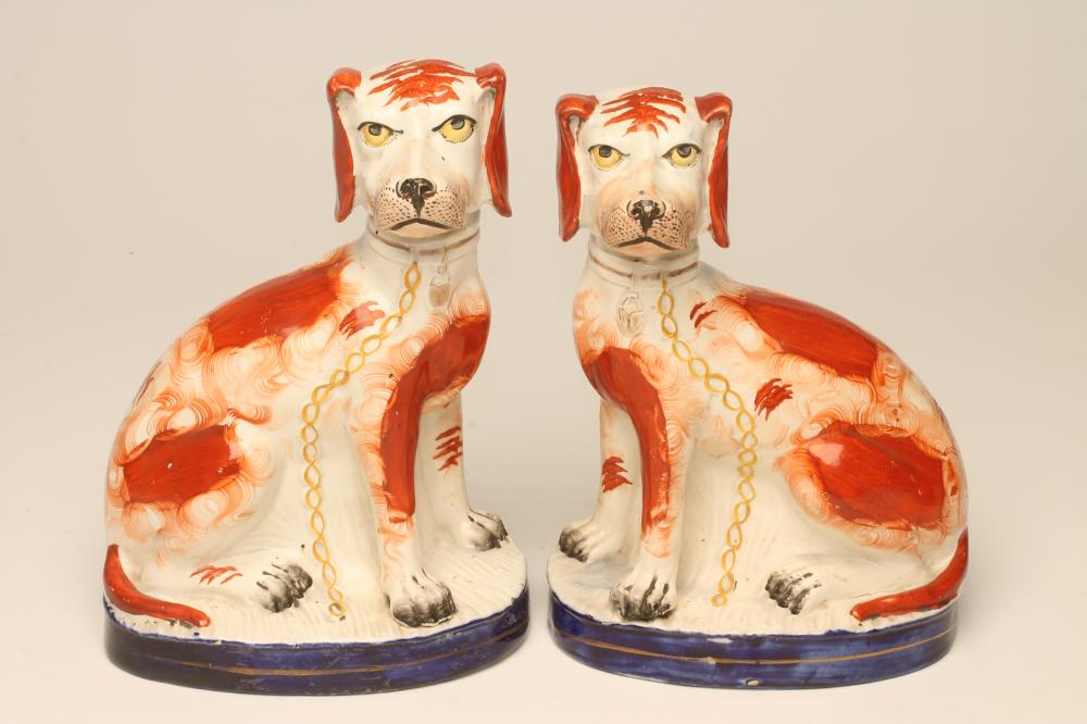 A PAIR OF VICTORIAN STAFFORDSHIRE POTTERY SPANIELS Image