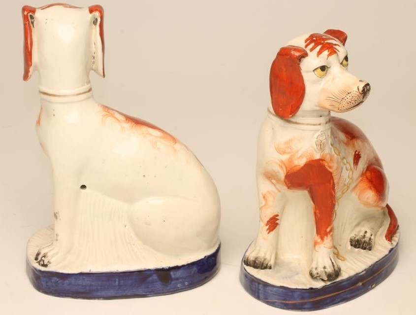 A PAIR OF VICTORIAN STAFFORDSHIRE POTTERY SPANIELS Image