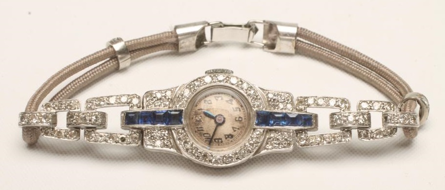 AN ART DECO DIAMOND AND SAPPHIRE COCKTAIL WATCH Image