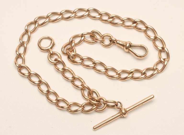 A 15CT GOLD CURB LINK ALBERT CHAIN with dog-clip fastener and bar Image