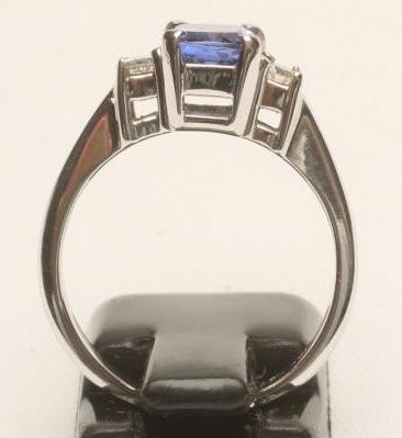 A TANZANITE AND DIAMOND THREE STONE RING Image