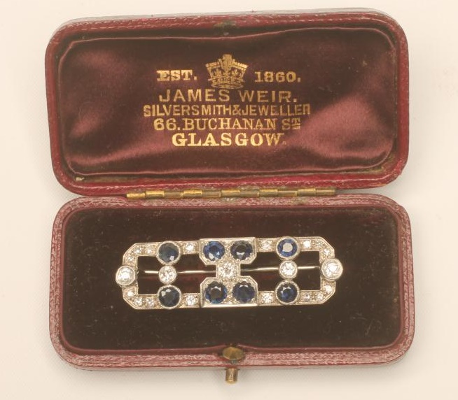 AN ART DECO SAPPHIRE AND DIAMOND BROOCH Image