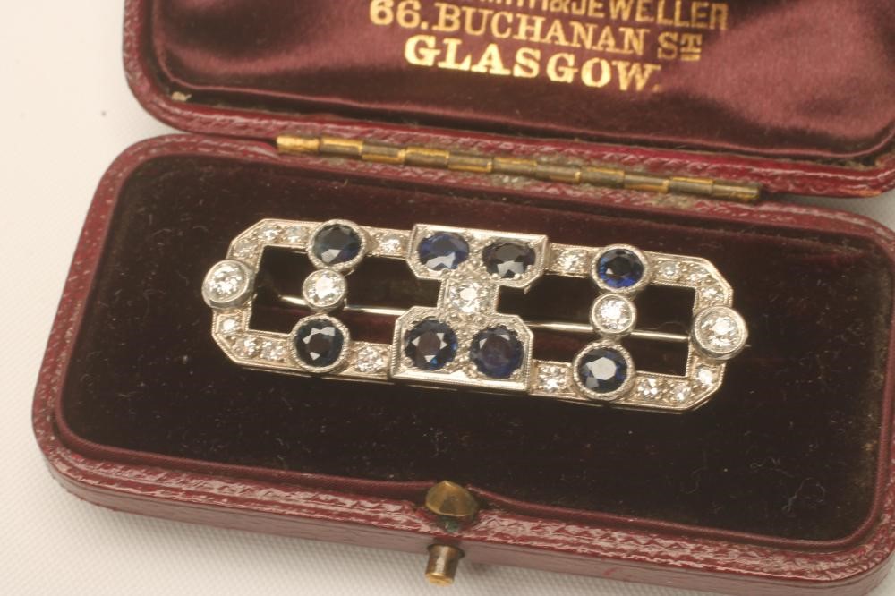 AN ART DECO SAPPHIRE AND DIAMOND BROOCH Image