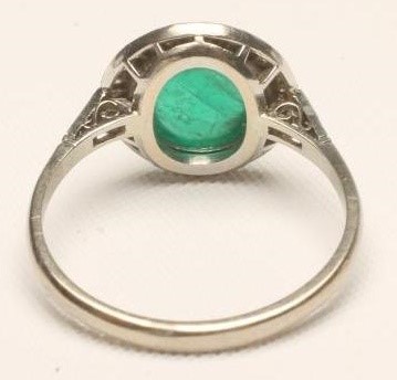 AN EMERALD AND DIAMOND RING Image