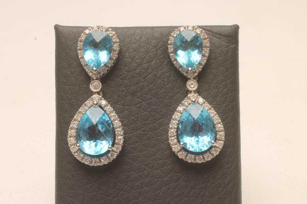 A PAIR OF BLUE TOPAZ AND DIAMOND CLUSTER DROP EAR STUDS Image