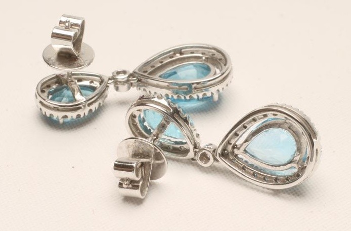 A PAIR OF BLUE TOPAZ AND DIAMOND CLUSTER DROP EAR STUDS Image